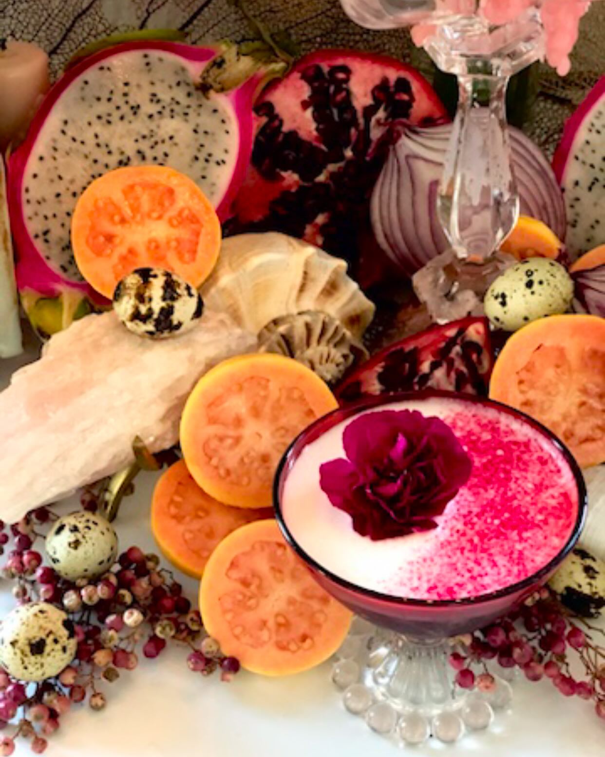 Rose cocktail with dragonfruit and pomegranate